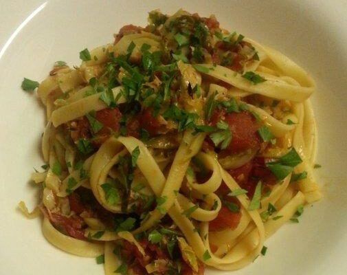 Fettuccine with brussel sprouts, leeks, and bacon in a light tomato sauce